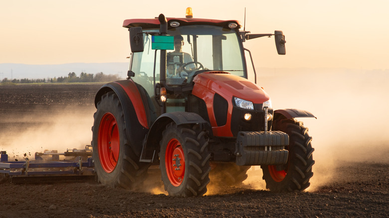 A tractor driving through a field.