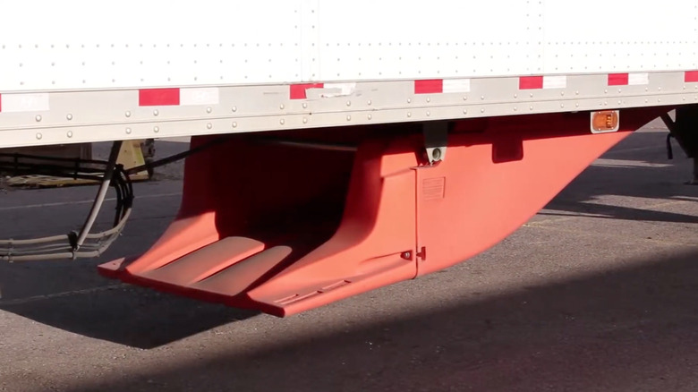 UnderTray beneath semi-truck trailer