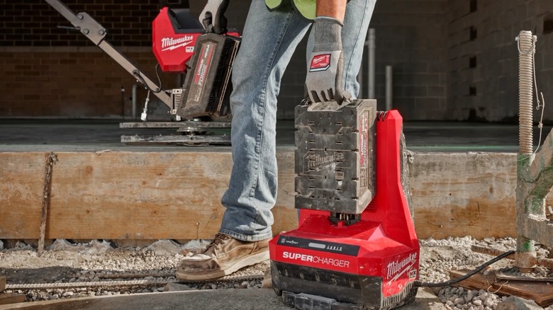 Swapping out Milwaukee Tool MX Fuel batteries on the super charger.