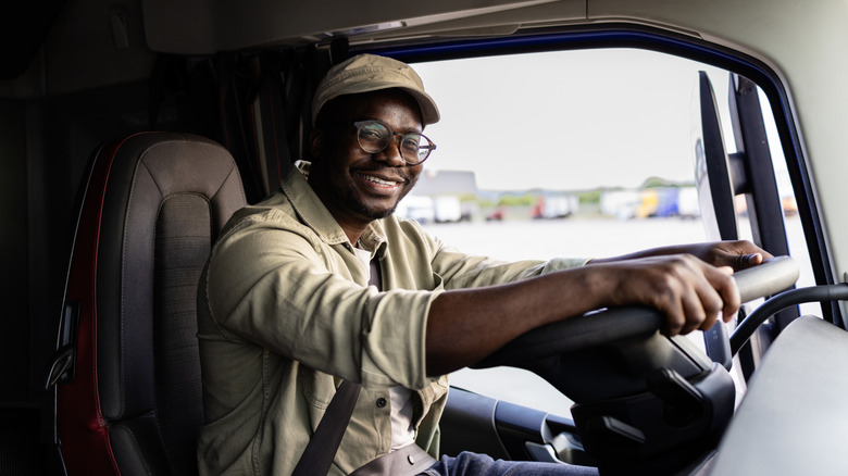 Smiling semi truck driver