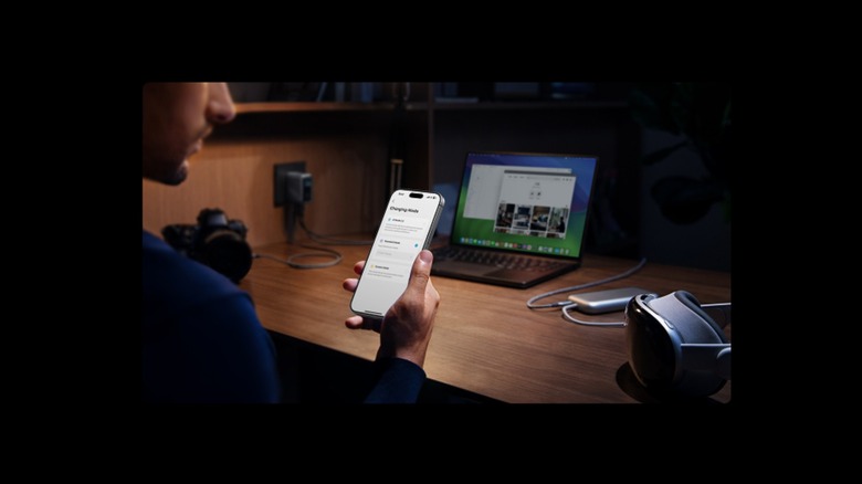 man viewing Anker app on phone