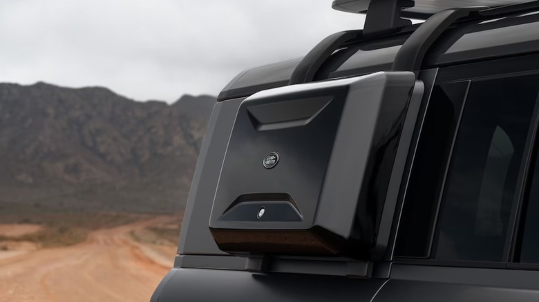 Black side-mounted gear carrier for Defender
