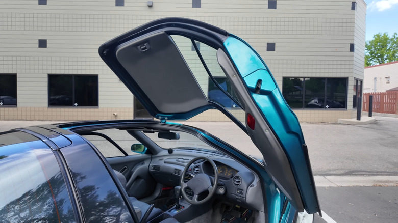A close-up of an open driver's side door on the Toyota Sera