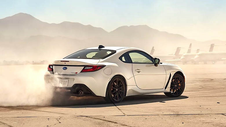 White Subaru BRZ sliding on an airport runway