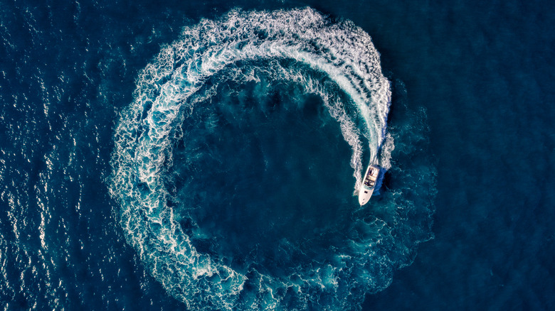 Aerial view of boat traveling in a circle.