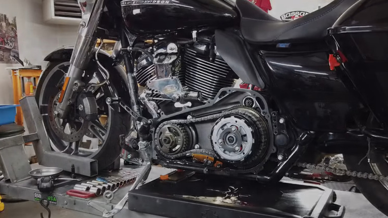 Side view of Harley-Davidson in shop with compensator shown