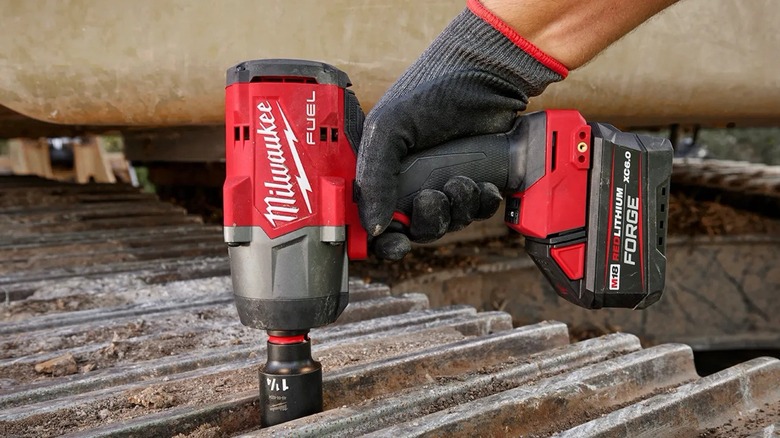 Milwaukee cordless impact wrench in use