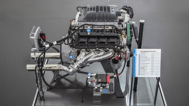 Side view of Mopar Hellephant crate motor on display stand.