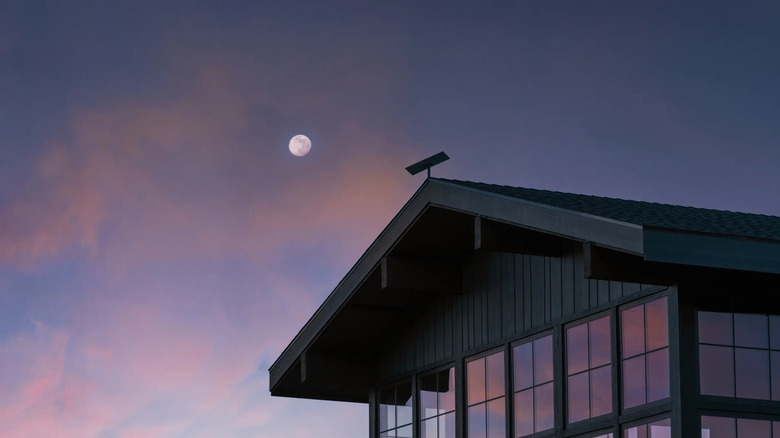 A Starlink dish fixed at the top of a home