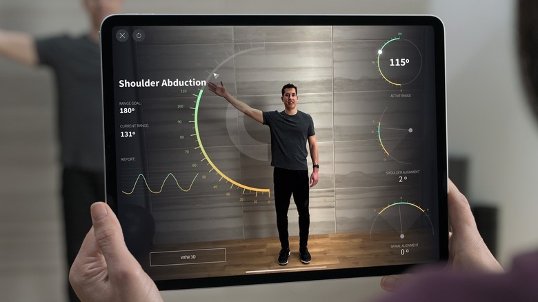 iPad with LiDAR sensor taking measurements of a man