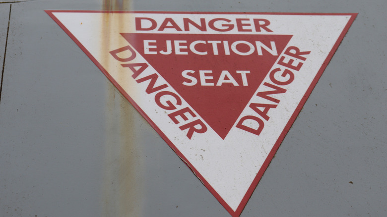 Ejection seat warning on the side of a jet