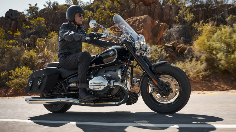 Side profile view of the BMW R18 cruising down the road