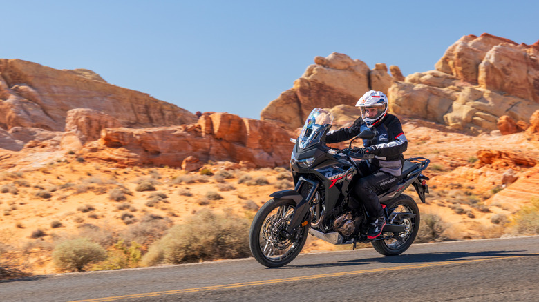 Person riding a Honda Africa Twin on a desert road