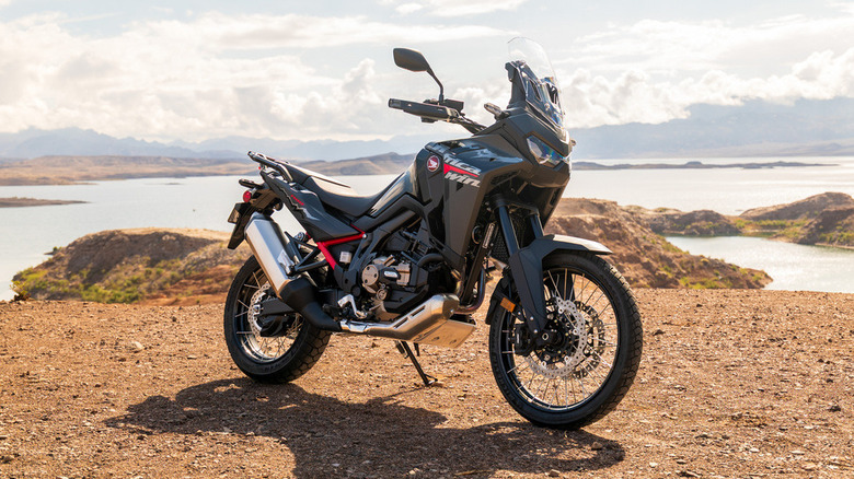 Honda Africa Twin parked near a lake