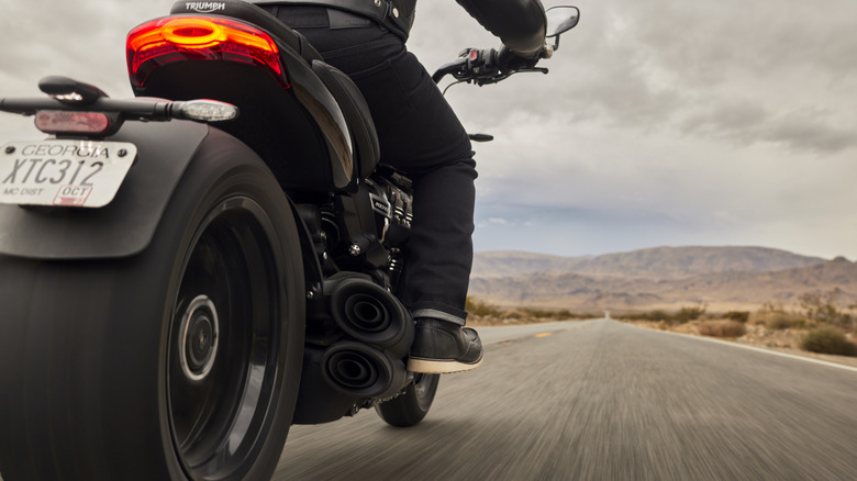 review profile of the of the 2025 Triumph Rocket 3 Storm GT in action on a clear road