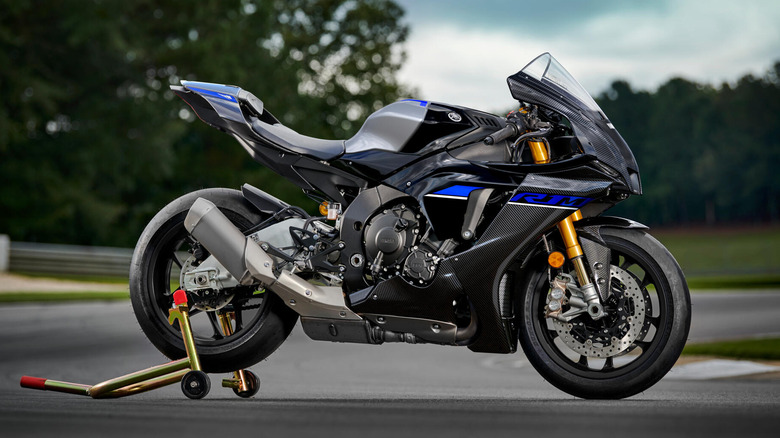 Side profile view of the 2024 Yamaha R1M on a lift jack