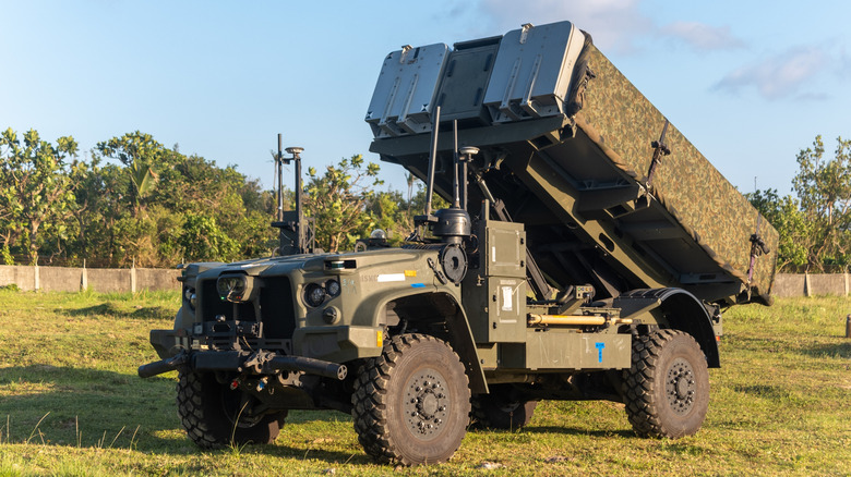 NMESIS missile system parked on grass.
