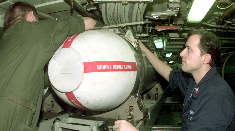 Tomahawk missile loaded onto a submarine.