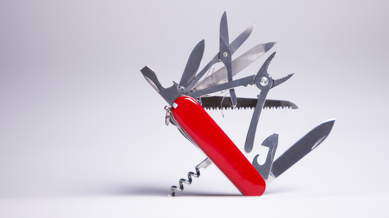 A Swiss Army knife will its attachments displayed