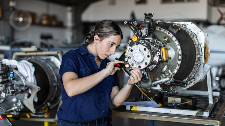 Engineer working on an engine