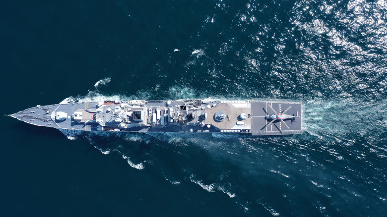 3D rendering of a nuclear submarine moving underwater.