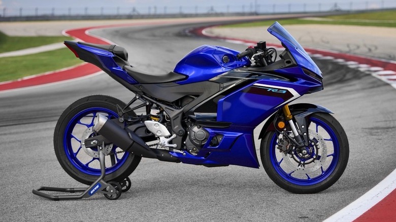 Yamaha R3 on a motorcycle stand at the race track