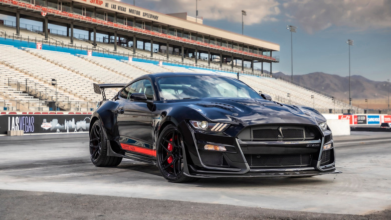 Black mustang on racetrack