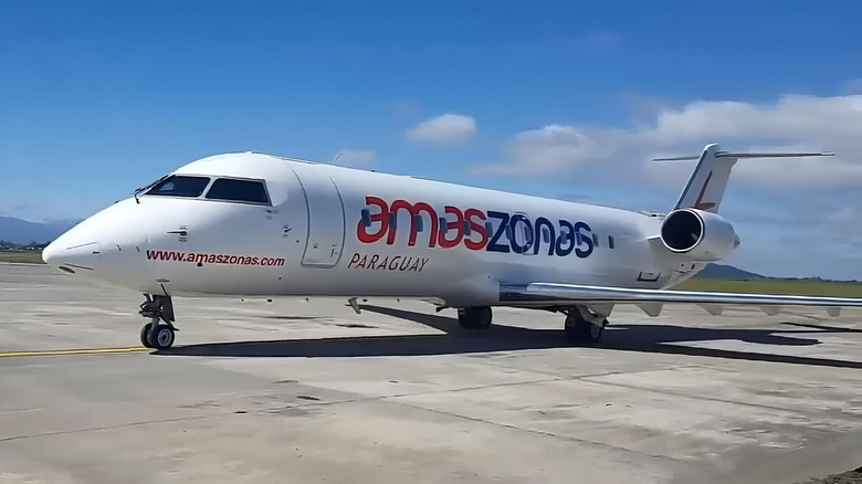 Bombardier CRJ-200 parked on runway