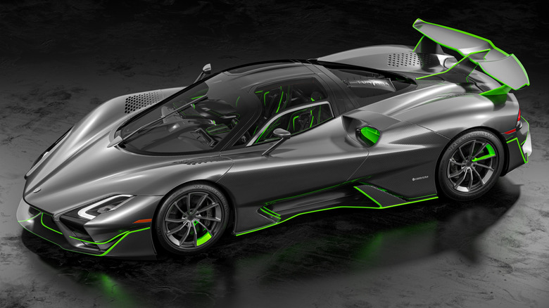 SSC Tuatara Striker parked, top-down left-side view, bare carbon livery with green accents