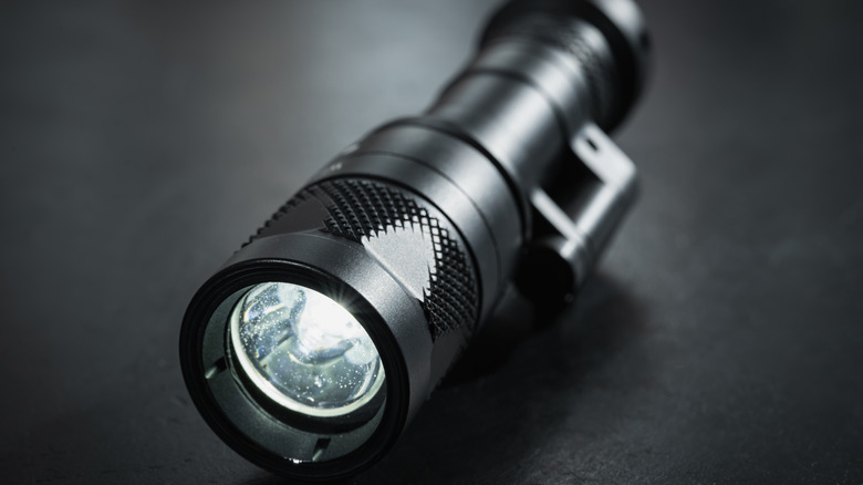 A closeup of a tactical flashlight