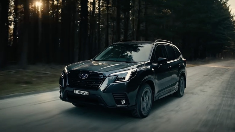 2024 Subaru Forester STI Sport on dirt road, front 3/4 view