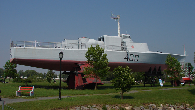 The HMCS Bras D'Or 400 on display in Quedbes park, white ship, red hull