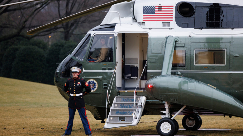 Marine standing by steps of Marine One