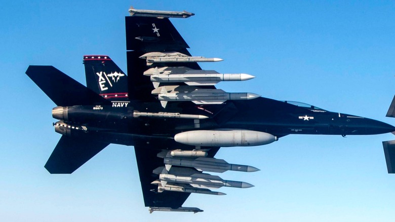 An VX-9 FA-18F in flight with AIM-174 missiles on four external hardpoints