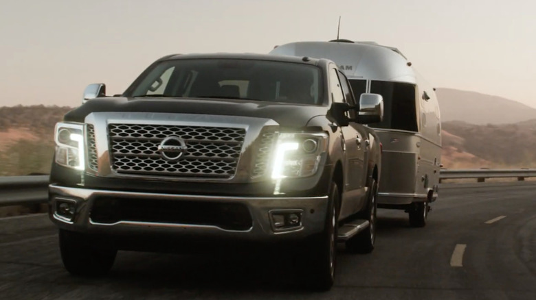 Front view of a 2017 Nissan Titan towing a trailer