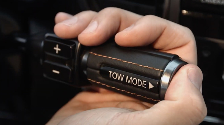 Close up of Tow mode button getting activated on a 2017 Nissan Titan truck