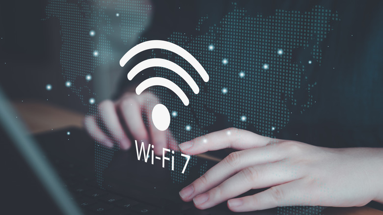 Person using computer laptop with Wi-Fi 7
