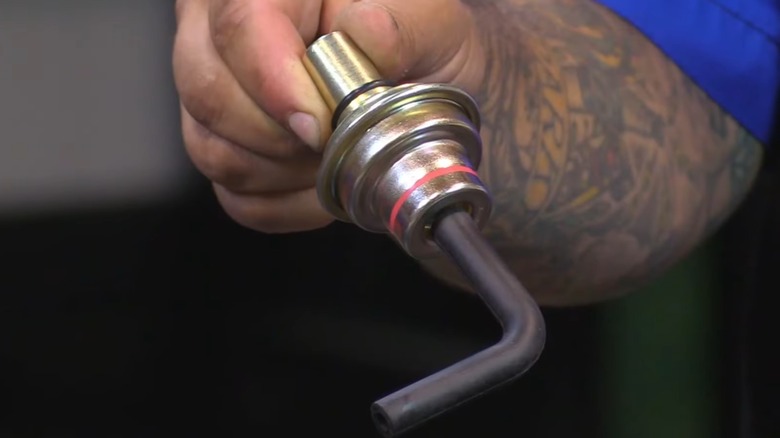 A person holding a transmission vacuum modulator