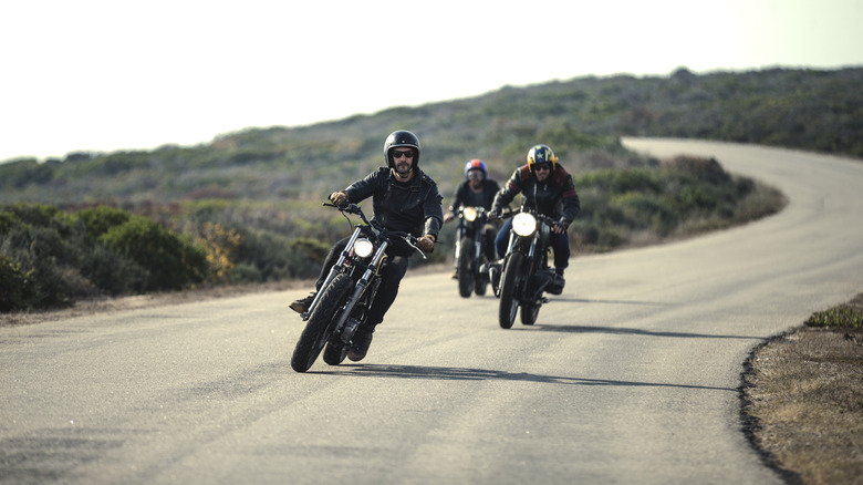 A group of three bikers cruising on the highway