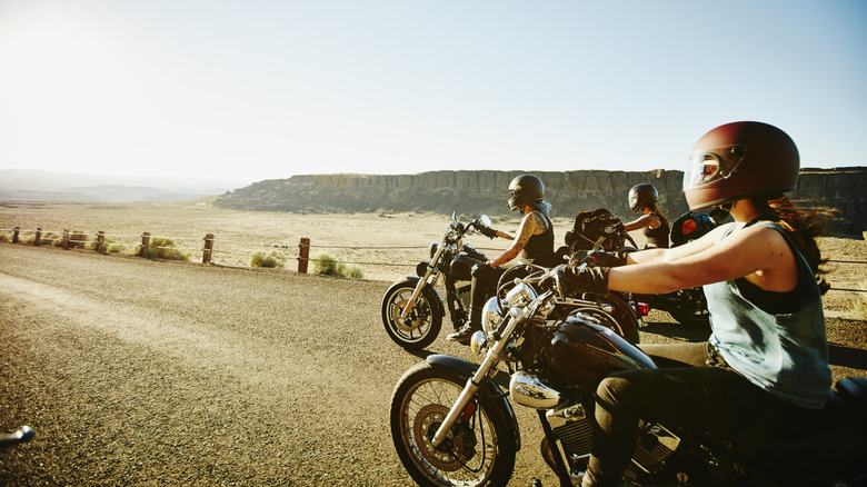 A group of female motorcyclists riding in group