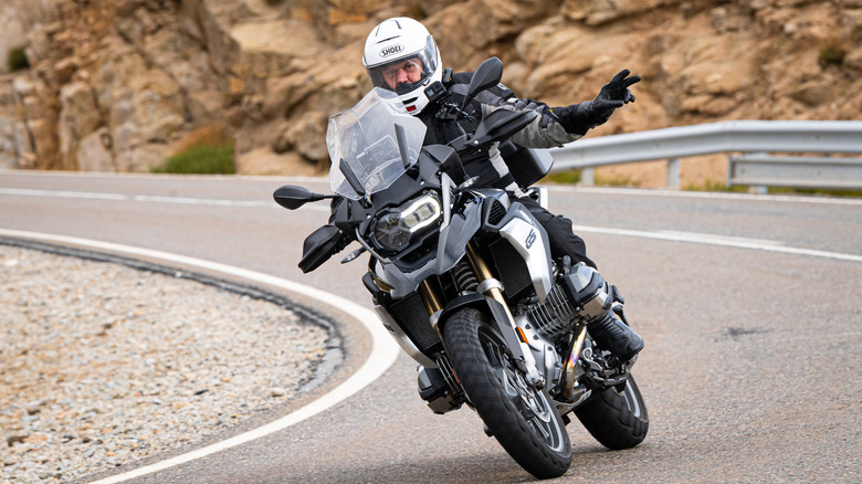 Motorcycle Rider Waving with two fingers