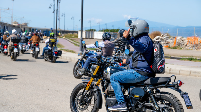 Motorcycle rider giving a thumbs up