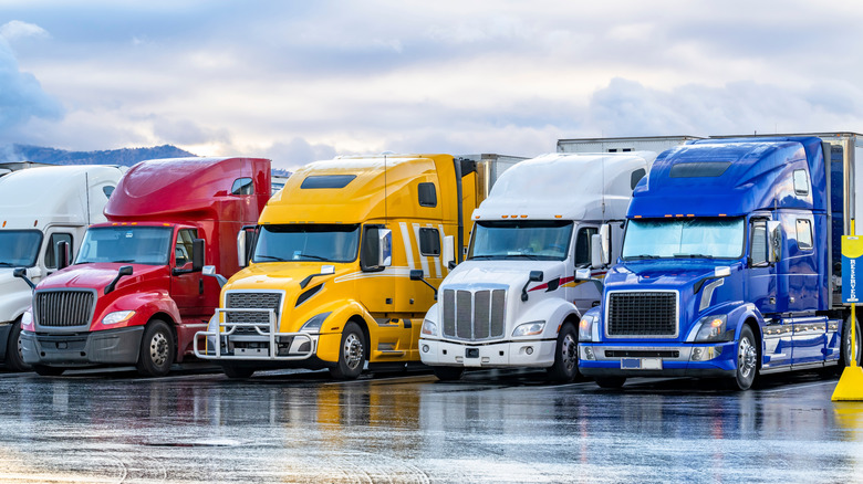 Rows of semi trucks in a parking lot