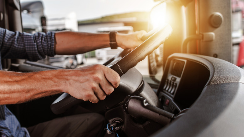 Closeup of a man driving a semi truck