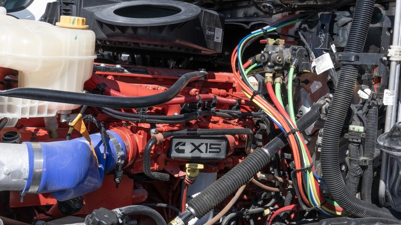 Close up shot of the Cummins X15 engine inside the engine bay of a truck.