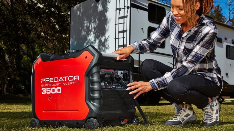 Woman plugging RV into a generator