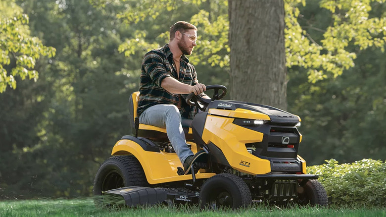 Person using Cub Cadet riding mower