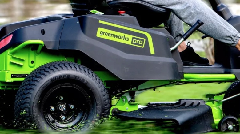 Person using Greenworks riding mower