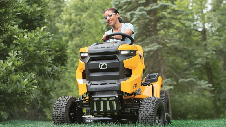Person using Cub Cadet riding mower