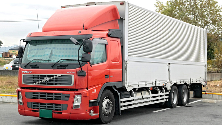 Red Volvo FM12 semi-truck parked